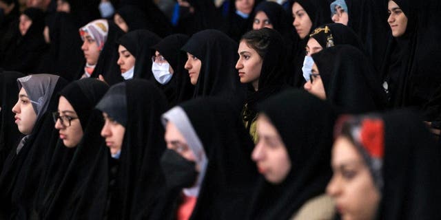 Female students attend a National Students Day ceremony at Tehran University in Tehran, Iran.