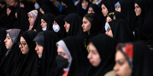 Female students attend a ceremony of National Student Day at Tehran University in Tehran, Iran.