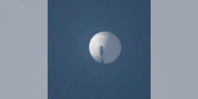 A balloon flies in the sky over Billings, Montana, Feb. 1, 2023, in this picture obtained from social media.