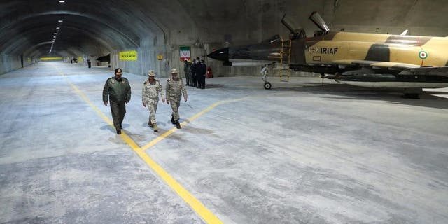 Iran's Army chief, Major General Abdolrahim Mousavi, and Iranian Armed Forces Chief of Staff Major General Mohammad Bagheri visit the first underground air force base, called "Eagle 44," at an undisclosed location in Iran.