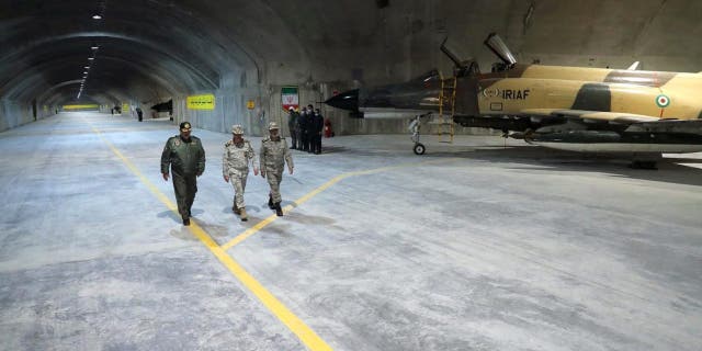 Iran's Army chief, Major General Abdolrahim Mousavi and Iranian Armed Forces Chief of Staff Major General Mohammad Bagheri visit the first underground air force base, called "Eagle 44" at an undisclosed location in Iran, in this handout image obtained on Feb. 7, 2023. 