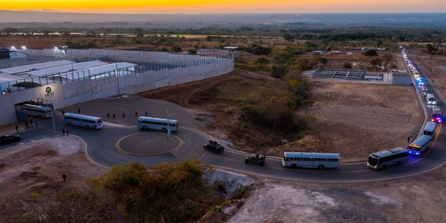 A general view shows a convoy in which 2,000 gang members were transferred to a terrorist detention center, according to Salvadoran President Naiba Bukele, in Tecoluca, El Salvador, in this fact sheet distributed by Reuters on February 24, 2023. 