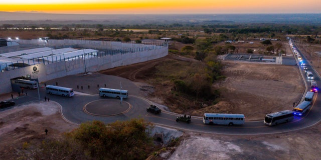 A general view shows a convoy in which 2,000 gang members were transferred to a terrorist detention center, according to Salvadoran President Naiba Bukele, in Tecoluca, El Salvador, in this fact sheet distributed by Reuters on February 24, 2023. 