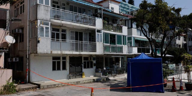 Cordons lines are seen outside a village house where part of Abby Choi's body was found in Hong Kong Feb. 27, 2023.