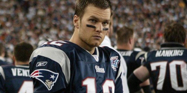 New England Patriots quarterback Tom Brady looks on during the fourth quarter of the Super Bowl XLII football game against the New York Giants at University of Phoenix Stadium on Feb. 3, 2008 in Glendale, Arizona.