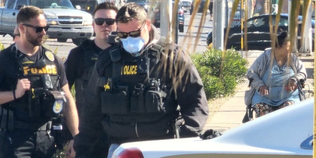 Phoenix police officers at the scene where one of their own ingested a substance that requested hospitalization and a dose of Narcan.