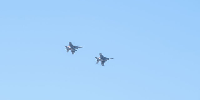 Two EA-18G Growlers, attached to Electronic Attack Squadron (VAQ) 129, fly overhead before arriving at Luke Air Force Base, Arizona, Feb. 7, 2023.