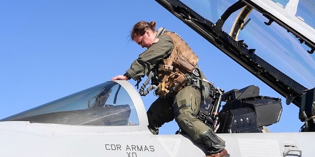 Lt. Lyndsay Evans, a Naval Aviator attached to Electronic Attack Squadron (VAQ) 129, exits an EA-18G Growler after arriving at Luke Air Force Base, Arizona, Feb. 7, 2023.