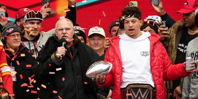 Chiefs head coach Andy Reid and Patrick Mahomes celebrate onstage during the Super Bowl LVII victory parade on February 15, 2023, in Kansas City, Missouri.