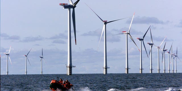 A vessel passes on offshore windmills group up successful nan North Sea adjacent Esbjerg, Denmark, connected Oct. 30, 2002. Germany wants to create a web of powerfulness lines to link nan country’s offshore upwind parks pinch those of its North Sea neighbors.