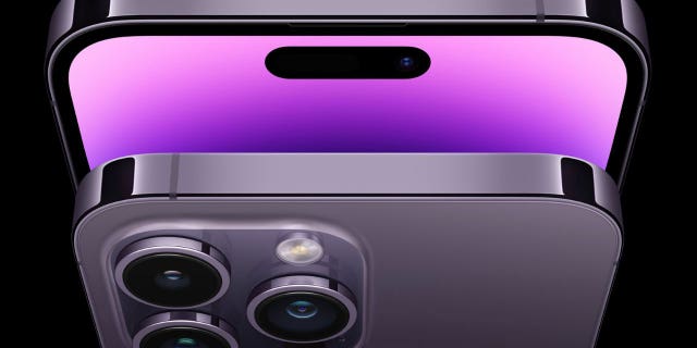 Top view of two iPhones, one showing the speaker and the other displaying three cameras. (Apple)