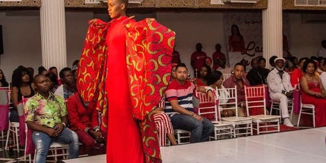 A model poses with clothing designed by Asya Khamsin who says those same clothes were worn by Sam Brinton. 