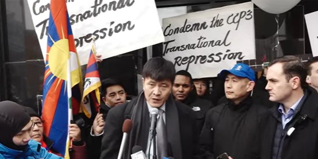 Chinese civil rights activist Zhou Fengsuo speaks at the press event held outside a recently raided Manhattan "police station" of the CCP.