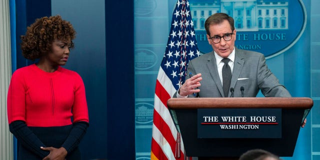 White House press secretary Karine Jean-Pierre listens as National Security Council spokesman John Kirby speaks during a press briefing at the White House, Monday, Feb. 27, 2023, in Washington.