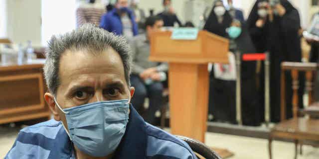 Iranian diplomat Jamshid Sharmahd attends his trial at the Revolutionary Court, in Tehran, Iran, on Feb. 6, 2022. Sharmahd, who was accused of orchestrating a deadly 2008 mosque bombing, has been sentenced to death in Iran.