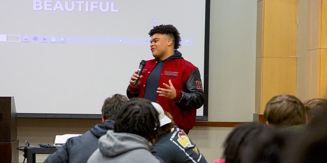 Elon University defensive lineman Jon Seaton speaks at his charity event aimed at giving back to women who are battling cancer on Feb. 2.