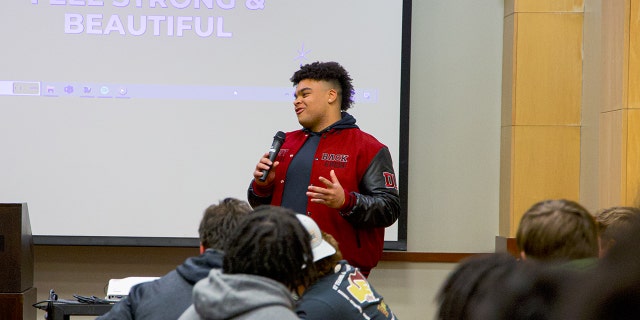 Elon University defensive lineman Jon Seaton speaks at his charity event aimed at giving back to women who are battling cancer on Feb. 2.