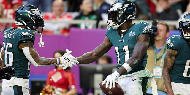 A.J. Brown #11 of the Philadelphia Eagles celebrates with Miles Sanders #26 of the Philadelphia Eagles after catching a 45-yard touchdown pass during the second quarter against the Kansas City Chiefs in Super Bowl LVII at State Farm Stadium on February 12, 2023, in Glendale, Arizona.