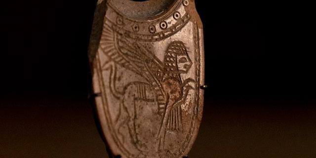 A 2,700-year-old ivory incense spoon plundered from a site in the occupied West Bank.