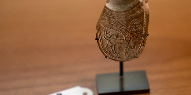 A 2,700-year-old ivory incense spoon displayed at the Palestinian Ministry of Tourism and Antiquities in the West Bank city of Bethlehem, Thursday, Jan. 19, 2023. 