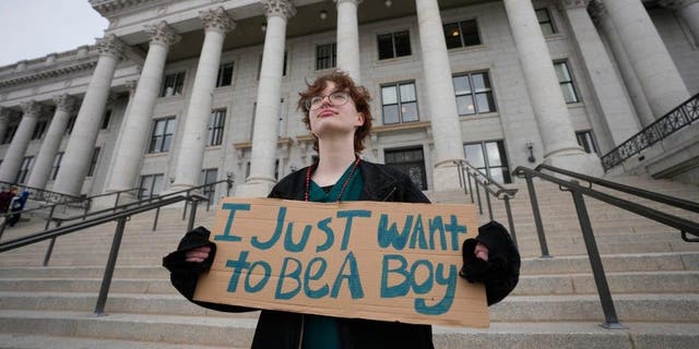 Tree Crane, 17, poses for a photograph following a rally where hundreds gathered in support of transgender youth at the Utah State Capitol in Salt Lake City on Jan. 24, 2023.