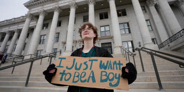 Tree Crane, 17, poses for a photograph following a rally where hundreds gathered in support of transgender youth at the Utah State Capitol in Salt Lake City on Jan. 24, 2023.