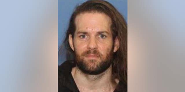 This undated photo provided by the Grants Pass Police Department shows Benjamin Obadiah Foster, who was accused of torturing a woman he held captive in Oregon.