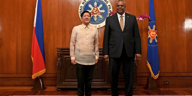 U.S. Secretary of Defense Lloyd James Austin III, right, poses with Philippine President Ferdinand Marcos Jr during a courtesy call at the Malacanang Palace in Manila, Philippines on Thursday, Feb. 2, 2023. 