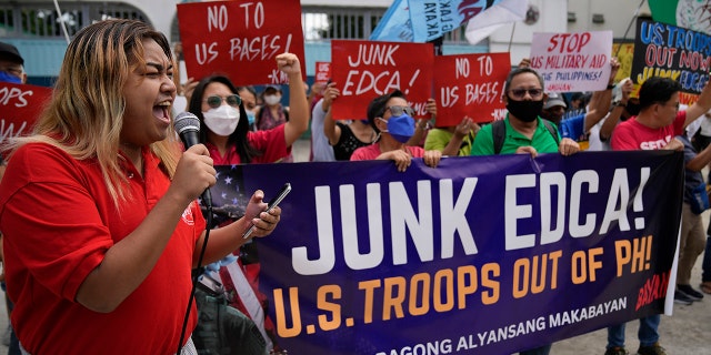 Demonstrators shout slogans as they protest against the visit of U.S. Defense Secretary Lloyd Austin outside Camp Aguinaldo military headquarters in metro Manila, Philippines on Thursday, Feb. 2, 2023.