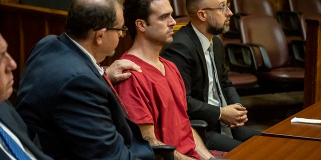 Attorney Phillip Reizenstein places his hand on the shoulder of telenovela star Pablo Lyle as the sentence is read by Judge Marisa Tinkler Mendez at Lyle's sentencing in Miami-Dade Criminal Court in Miami, Friday, Feb. 3, 2023.