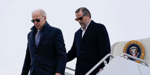 President Joe Biden and his son, Hunter Biden, step off Air Force One, Saturday, Feb. 4, 2023, at Hancock Field Air National Guard Base in Syracuse, N.Y. The Bidens are in Syracuse to visit with family members following the passing of Michael Hunter, the brother of the president's first wife, Neilia Hunter Biden. 