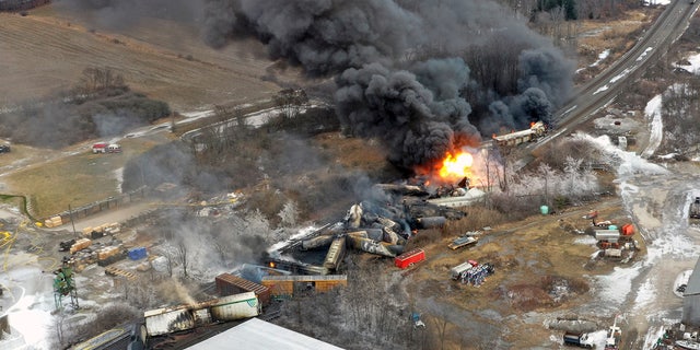 This photo taken with a drone shows portions of a Norfolk Southern freight train that derailed in East Palestine, Ohio, late on Feb. 3 and remained on fire at midday the following day.