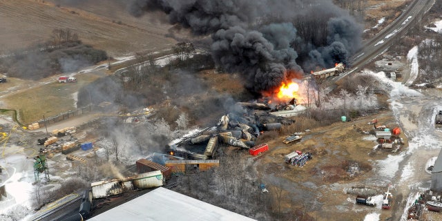 This photo taken with a drone shows portions of a Norfolk Southern freight train that derailed in East Palestine, Ohio, late on Feb. 3 and remained on fire at midday the following day.