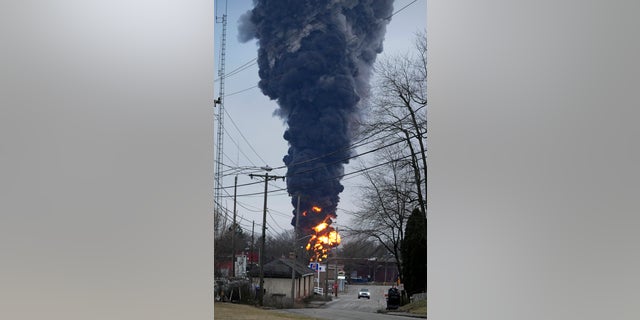 A black plume rose over East Palestine, Ohio, as a result of a controlled detonation of a portion of the derailed Norfolk and Southern trains on Feb. 6, 2023. 