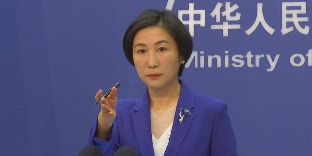 Chinese Foreign Ministry spokesman Mao Ning gestures during a news conference in Beijing, October 13, 2022.