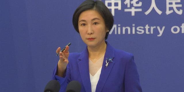 Chinese Foreign Ministry spokesman Mao Ning gestures during a news conference at the Ministry of Foreign Affairs in Beijing.