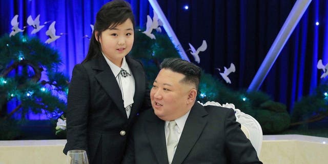 North Korean leader Kim Jong Un and his daughter attend a feast to mark the 75th founding anniversary of the Korean People’s Army at an unspecified place in North Korea Tuesday, Feb. 7, 2023. 