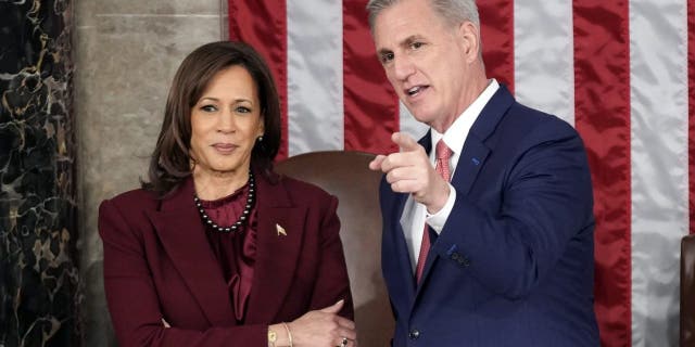 Vice President Kamala Harris talks with House Speaker Kevin McCarthy.