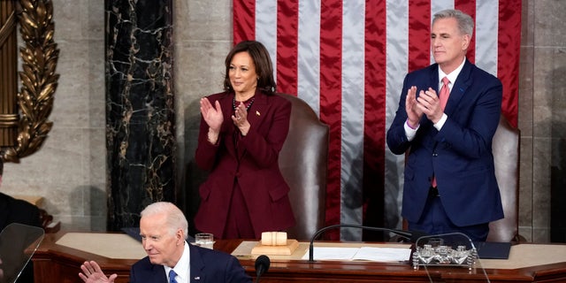 President Biden waves as he delivers the State of the Union address to a joint session of Congress at the U.S. Capitol, Tuesday, Feb. 7, 2023, in Washington. Vice President Kamala Harris and House Speaker Kevin McCarthy applaud.