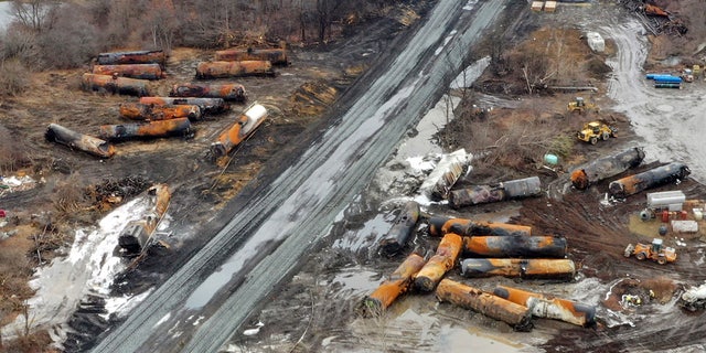 This photo taken with a drone on Feb. 9 shows the continuing cleanup of portions of a Norfolk Southern freight train that derailed on Feb. 3 in East Palestine, Ohio.