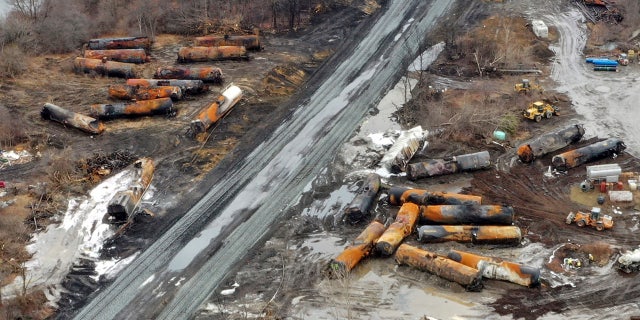 This photo taken with a drone on Feb. 9 shows the continuing cleanup of portions of a Norfolk Southern freight train that derailed on Feb. 3 in East Palestine, Ohio.