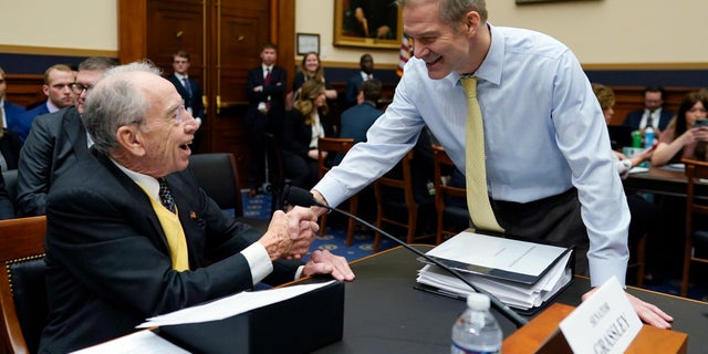 Select Subcommittee on the Weaponization of the Federal Government Chairman Jim Jordan, R-Ohio, shakes hands with Sen. Chuck Grassley, R-Iowa, before the start of the ubcommittee hearing on Capitol Hill, Thursday, Feb. 9, 2023, in Washington. (AP Photo/Carolyn Kaster)