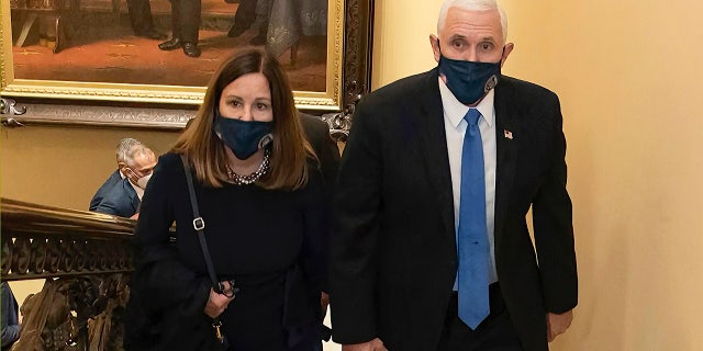 Former Vice President Mike Pence, seen with his wife Karen walk at the Capitol, was subpoenaed as part of the Justice Department's special counsel investigation.