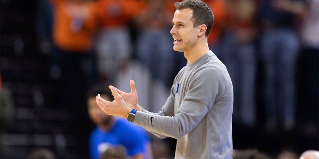 Duke head coach Jon Scheyer disagrees with a referee during the first half of an NCAA college basketball game against Virginia in Charlottesville, Virginia on Saturday, February 11, 2023.