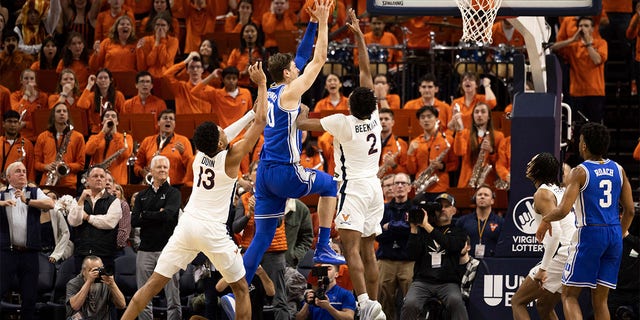 Duke's Kyle Filipowski (30) goes for a basket against Virginia during the second half of an NCAA college basketball game in Charlottesville, Va., Saturday, Feb. 11, 2023.