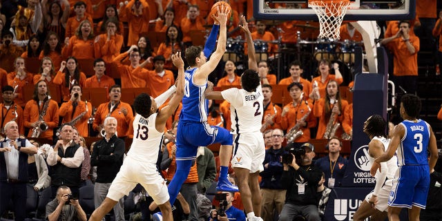 Duke's Kyle Filipowski (30) goes for a basket against Virginia during the second half of an NCAA college basketball game in Charlottesville, Virginia on Saturday, February 11, 2023.