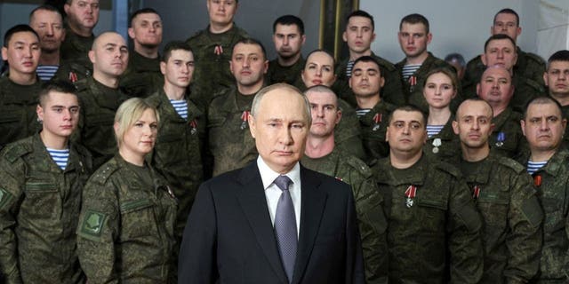 President Vladimir Putin speaks in his annual televised New Year's message after a ceremony during a visit to the headquarters of the Southern Military District, at an unknown location in Russia, on Saturday, Dec. 31, 2022. Putin sent Russian forces into Ukraine on Feb. 24, 2022, and appears determined to prevail.
