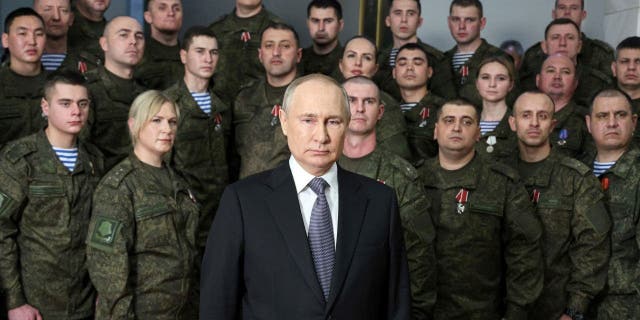 President Vladimir Putin speaks in his annual televised New Year's message after a ceremony during a visit to the headquarters of the Southern Military District, at an unknown location in Russia, on Saturday, Dec. 31, 2022. Putin sent Russian forces into Ukraine on Feb. 24, 2022, and appears determined to prevail.