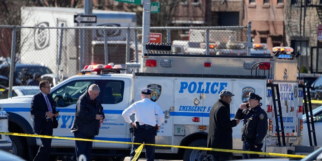 New York Police gather at the scene where a rental truck was stopped and the driver arrested, Monday, Feb. 13, 2023, in New York. Police stopped a U-Haul truck and detained the driver after reports that the vehicle struck multiple pedestrians in New York City on Monday. Authorities say the driver of the truck fled the scene after mounting a sidewalk in the Bay Ridge neighborhood of Brooklyn and injuring several people.