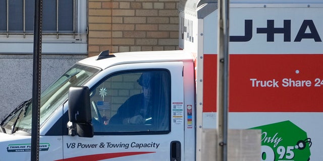 A member of the NYPD bomb squad examines the cab of a rental truck that was stopped on Feb. 13, 2023, in Bay Ridge, Brooklyn. 